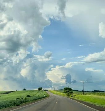 Winding Path Under Cloudy Sky Stock Photos