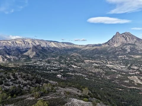 Winding Pathway Toward Distant Mountain Top, Journey Along Rugged Trail Beneath Stock Photos