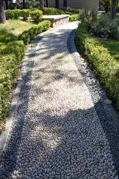 Winding pebble garden path Stock Photos