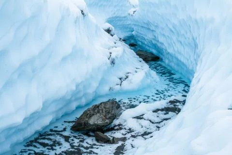 Winding river course cut from solid ice on the Matanuska Glacier Stock Photos