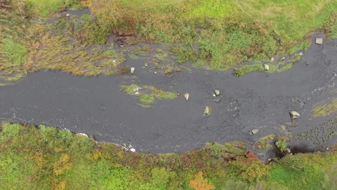 A winding river flowing through a green countryside landscape. Stock Footage 318360376