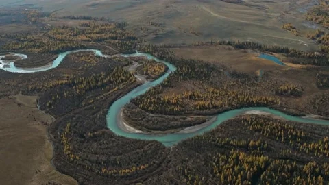 Winding river flowing through hilly valley Stock Footage 153619712