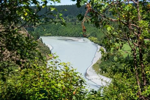 Winding River Surrounded by Lush Greenery Stock Photos