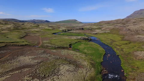 Winding river through green moss valley Iceland Video stock 318968868