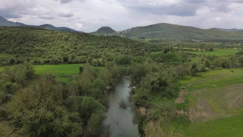Winding River Through Green Valley and Hills in Greece Stock Footage 337164628