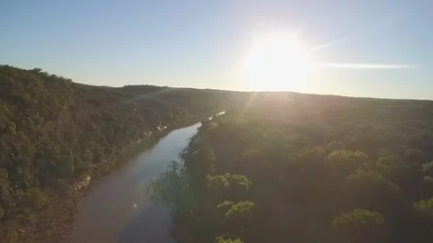 Winding river under a setting sun Stock Footage 90673079