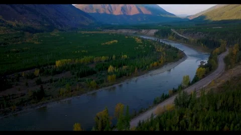 Winding river valley with autumn trees and mountains at sunset Stock-Footage 341329118