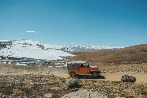 Winding road along mountain range at Deosai National Park, Pakistan. Stock Photos
