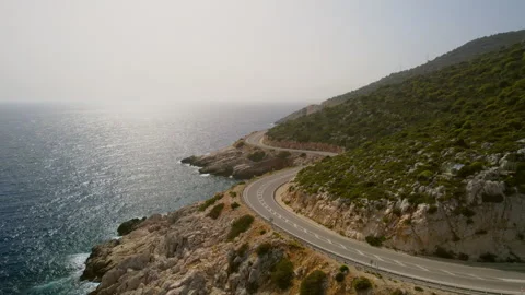 A winding road along the sea Stock Footage 254774945