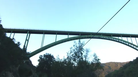 Winding Road with Bridge in Foreground Stock Footage 64960306