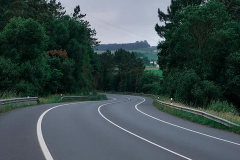 Winding road in the forest Stock Photos