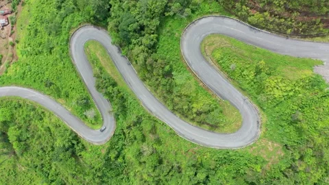 Winding road in the forest The top view of the beautiful Aerial view  Stock Footage 141522003