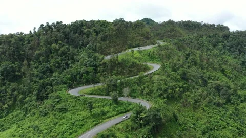 Winding road in the forest The top view of the beautiful Aerial view  Stock Footage 141522190