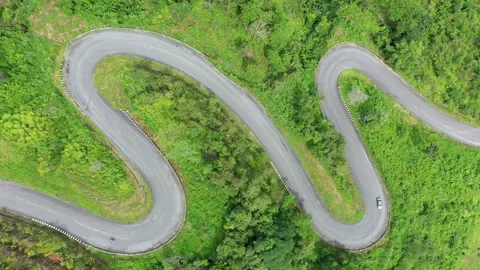Winding road in the forest The top view of the beautiful Aerial view  Stock Footage 141522387