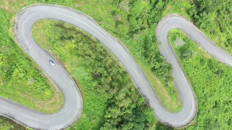 Winding road in the forest The top view of the beautiful Aerial view  Stock Footage 141927359