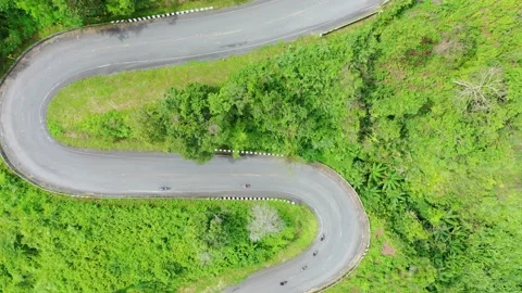 Winding road in the forest The top view of the beautiful Aerial view of asphalt  Stock Footage 142298458