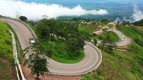 Winding road in the forest The top view of the beautiful Aerial view of asphalt  Stock Footage 148155449