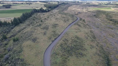 Winding road leading to an extinct volcano Stock Footage 157618235