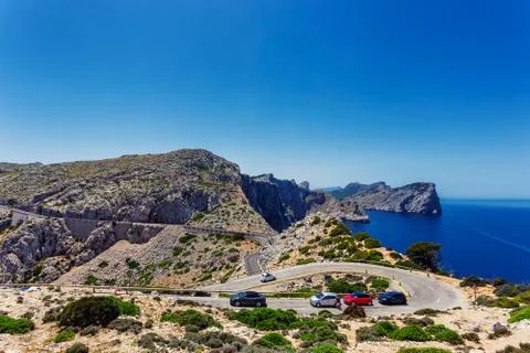 Winding road to lighthouse of Cap de Formentor and rocky coast of Mediterrane Stock Photos