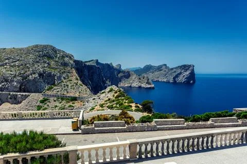 Winding road to lighthouse of Cap de Formentor and rocky coast of Mediterrane Stock Photos