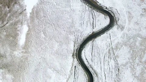 Winding road in the mountains during winter aerial view Stock Footage 234205964