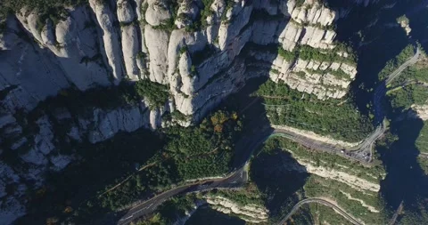 Winding road near the cliff of Mount Montserrat Stock Footage