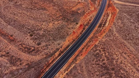 Winding road through brown and red hills in Spain during daylight Stock-Footage 333112819
