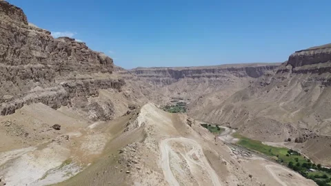 Winding Road Through a Dramatic Mountain Landscape Stock Footage 345634056