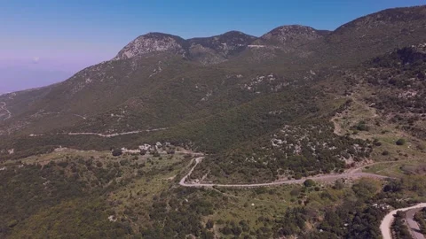 Winding Road Through Green Mountain Valley in Peloponnese, Greece Stock Footage 337864947