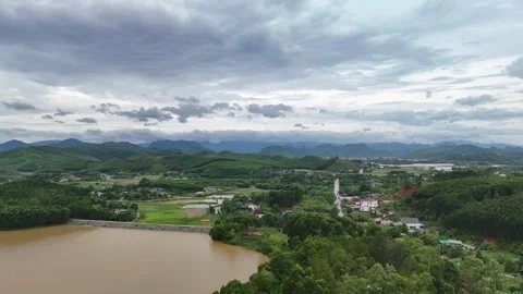 Winding road through green mountains and houses in Quang Binh. Stock Footage 313664692