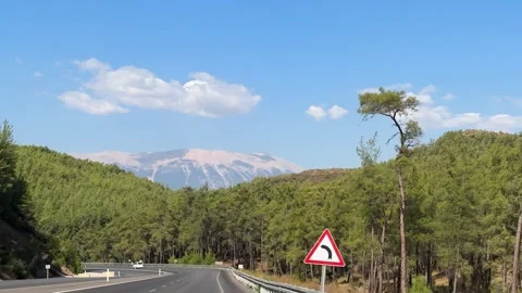 Winding road through the lush mountains of Turkey, scenic route for travel by Stock-Footage 273781841