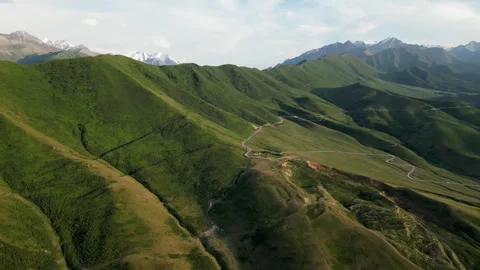 Winding road through mountain pass. Kyrgyzstan natural landscape, aerial view Stock Footage 288791834