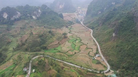Winding Road Through Mountains and Farms in Northern Vietnam Aerial Drone Vi Stock Footage 124355183