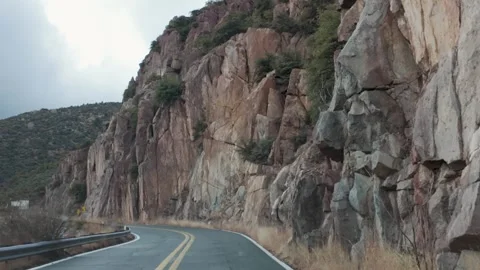 Winding Road Through Rocky Cliffs on Highway AZ-89A Stock Footage 281873157