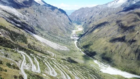 Winding roads in the high snow-capped mountains of Peru Stock Footage 320021013