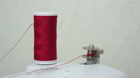 Winding Up a Sewing Bobbin With Thread Stock Footage 43067125
