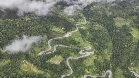 Winding snake road through Ha Giang mountains, northern Vietnam – Drone 4K Video stock 325036236