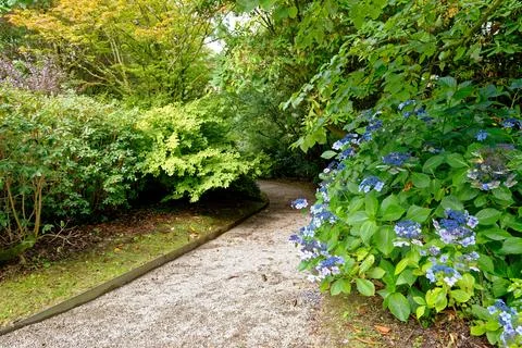 Winding Stone Path Through Manicured English Country Estate Garden Stock Photos