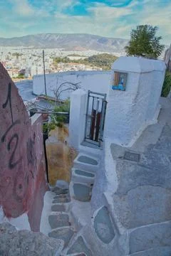 Winding stone steps lead down from a hillside village toward a beautiful va.. Stock Photos