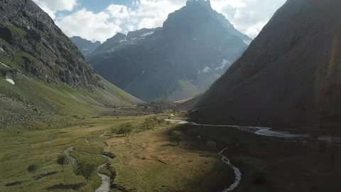 Winding streams meandering through a lush valley in Alpes-Ecrins, France Stock Footage 301375353