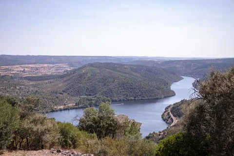 The winding Tejo River flowing through lush green hills Stock Photos
