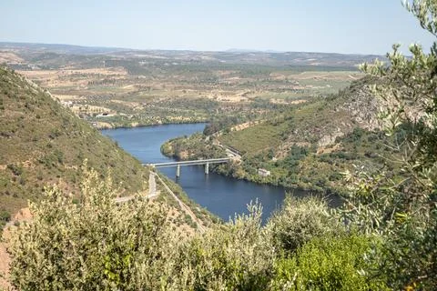 The winding Tejo River flowing through lush green hills Stock Photos