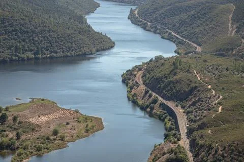 The winding Tejo River flowing through lush green hills Stock Photos