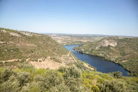 The winding Tejo River flowing through lush green hills Stock Photos