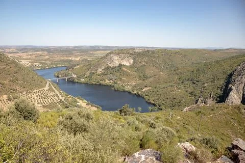 The winding Tejo River flowing through lush green hills Stock Photos