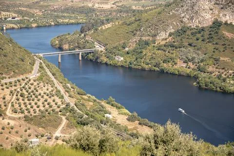 The winding Tejo River flowing through lush green hills Stock Photos
