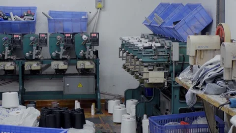 Winding of thread from large bobbins to smaller ones on high speed Stock Footage 89706945