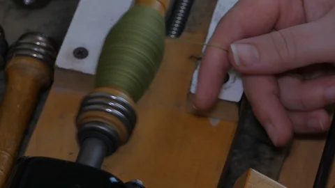 Winding thread for the weaving shuttle 14 Stock Footage 126960593