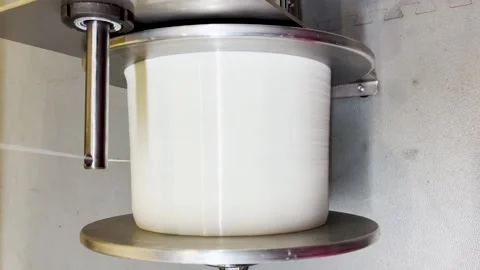 Winding threads on an industrial winder Stock Footage 239646151