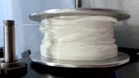 Winding threads on an industrial winder Stock Footage 239646460